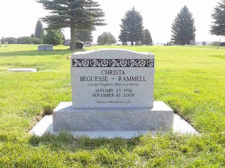 Custom upright granite headstone with etched portrait
